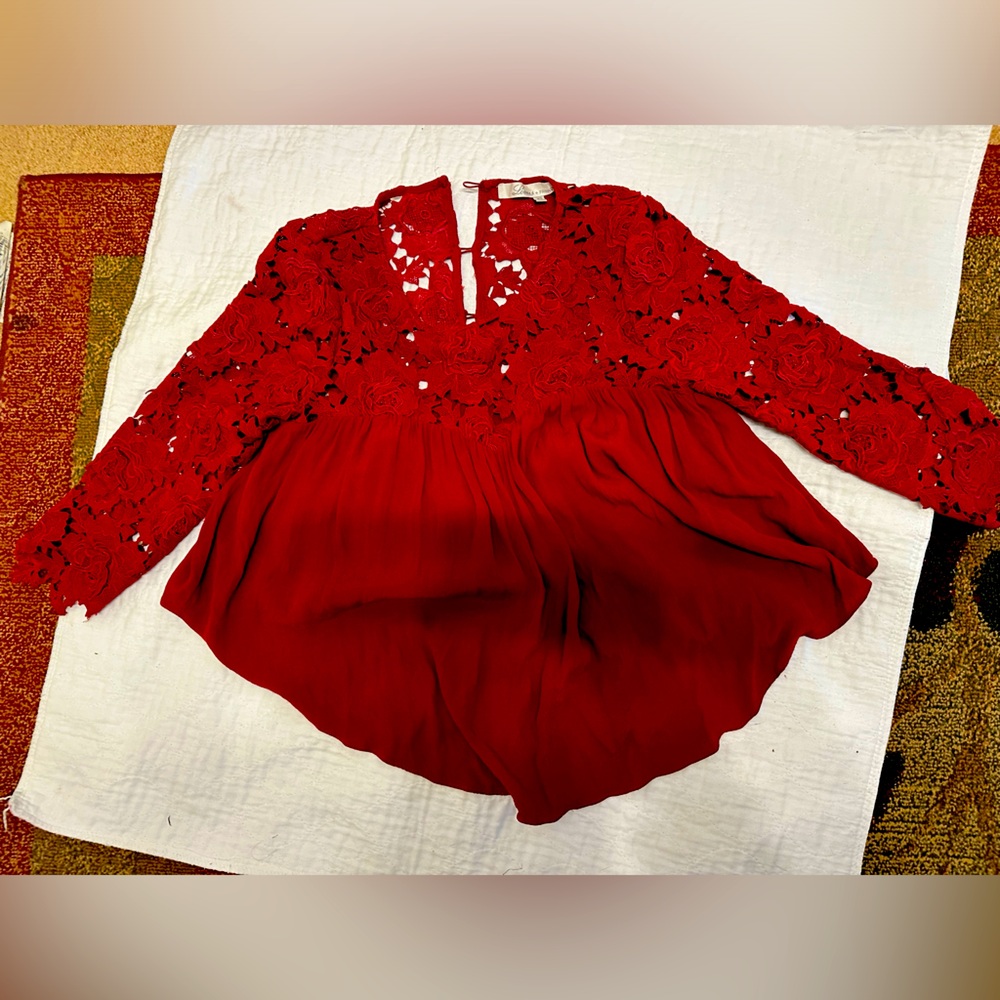 Beautiful blouse. Never worn. All buttons intact.